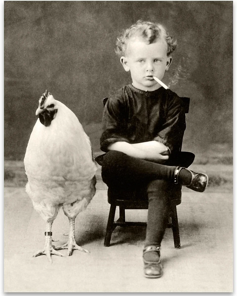 Unframed 11x14 vintage-style oddities-and-curiosities poster print depicting a bizarre boy posed alongside a giant chicken, pitched as weird goth wall art for home or bathroom decor