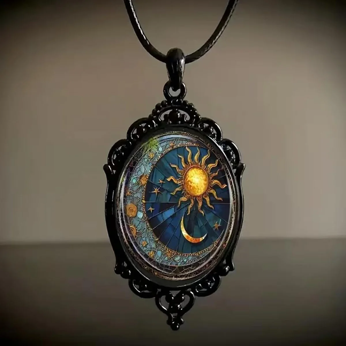 Gothic glass pendant necklace with a vintage lunar cameo under a domed glass, strung on a rope chain, witch-style sun and moon jewelry