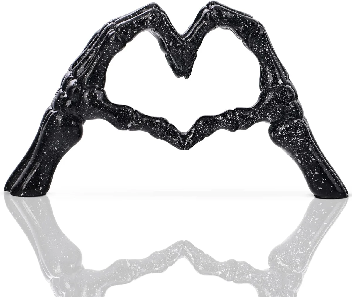 Black skeleton hands arranged around a heart form, gothic sculptural ornament for tabletop or shelf display