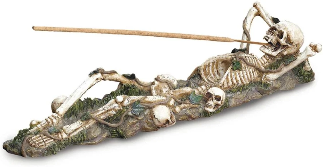 Skeleton-shaped incense burner holder with skeletal form serving as functional collectible vessel