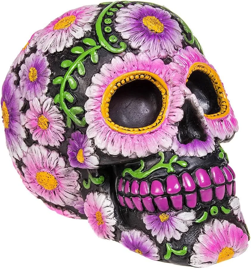 Pale pink resin skull sculpture, 14.5cm tall, Nemesis Now Sugar Petal—memento mori rendered in glossy pink